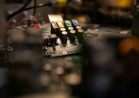 Close-up of a populated printed circuit board prototype on the bench